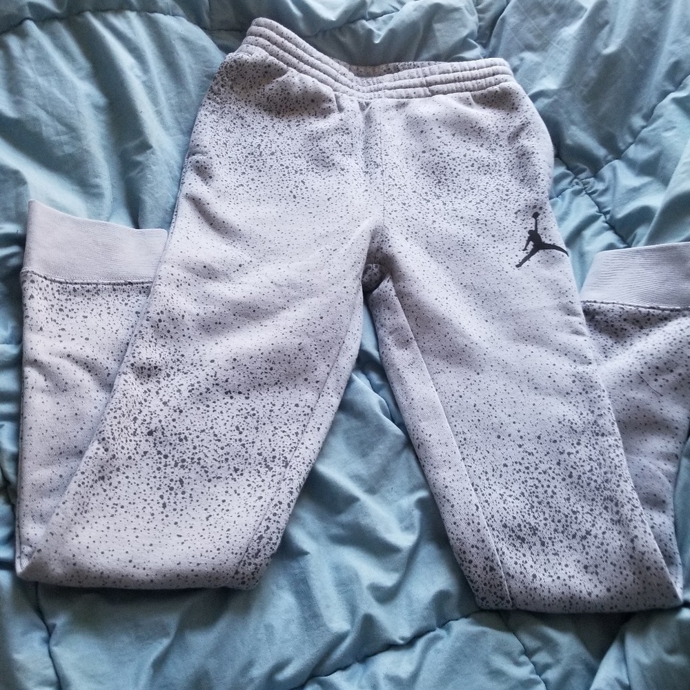 Sweat pants.  Light gray with black splash
